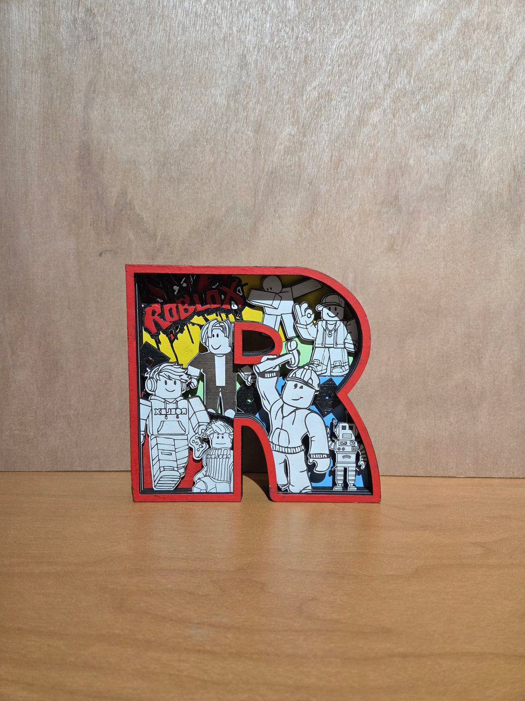 Game character "R" shelf sitter