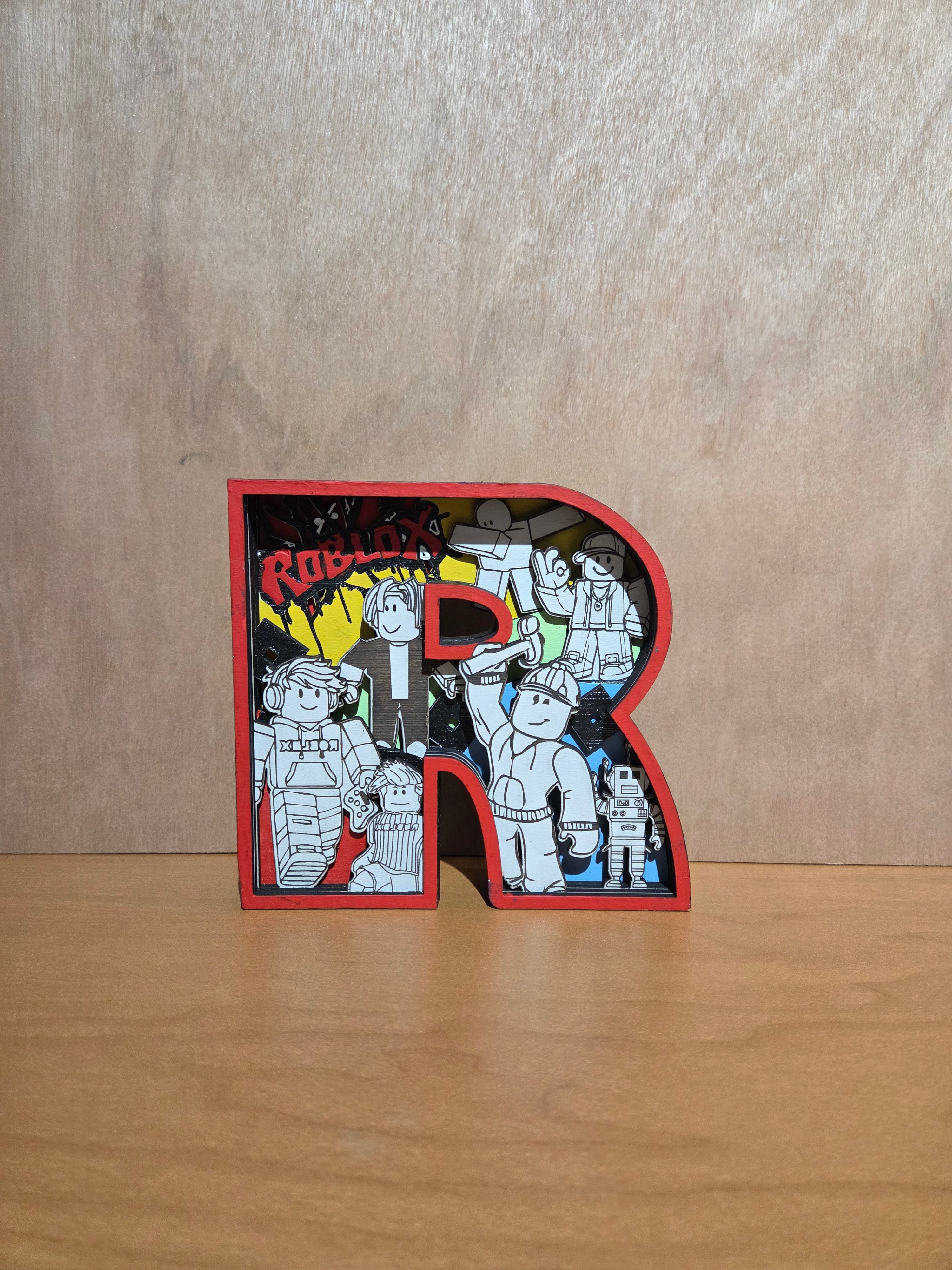 Game character "R" shelf sitter