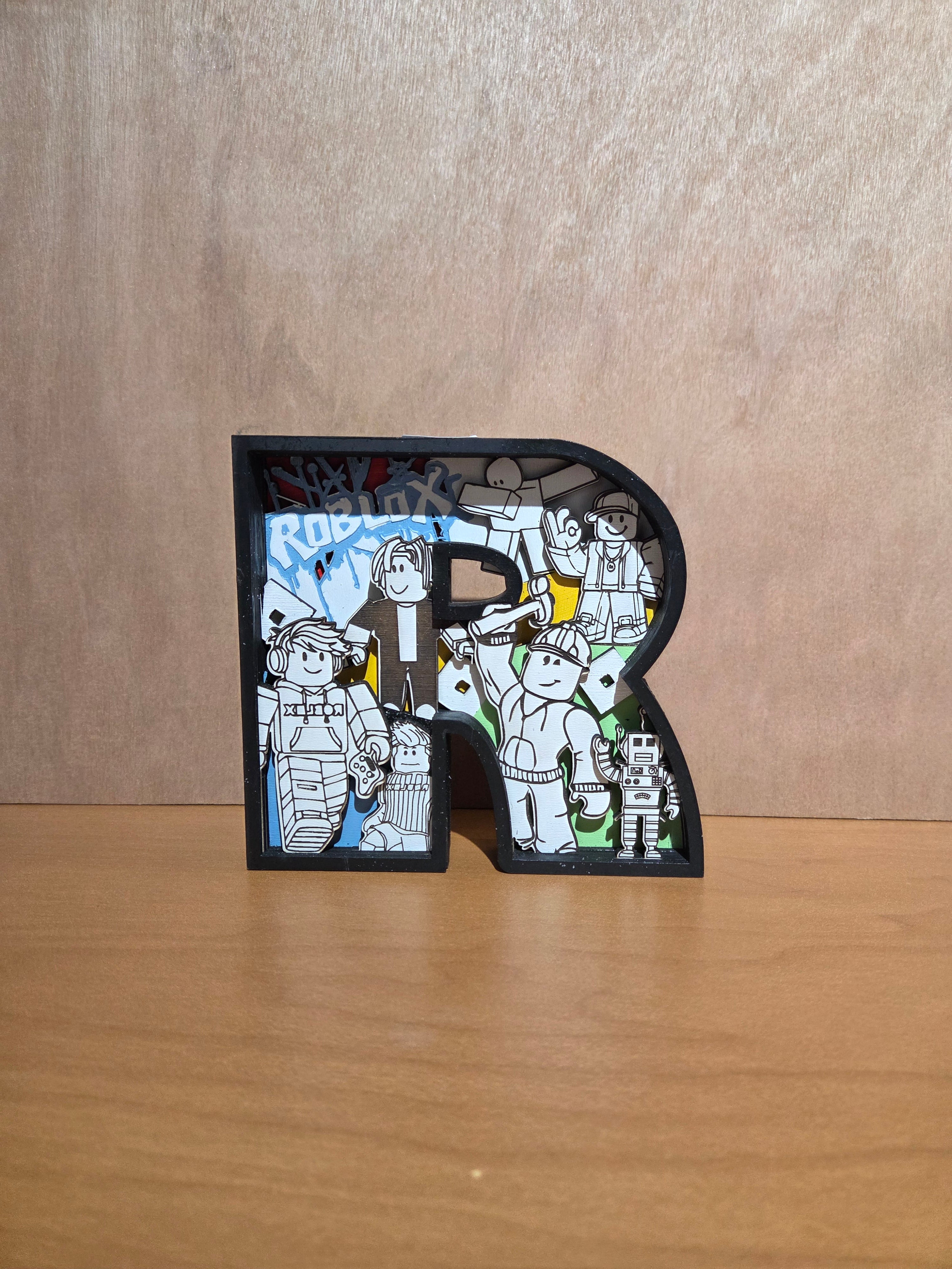 Game character "R" shelf sitter